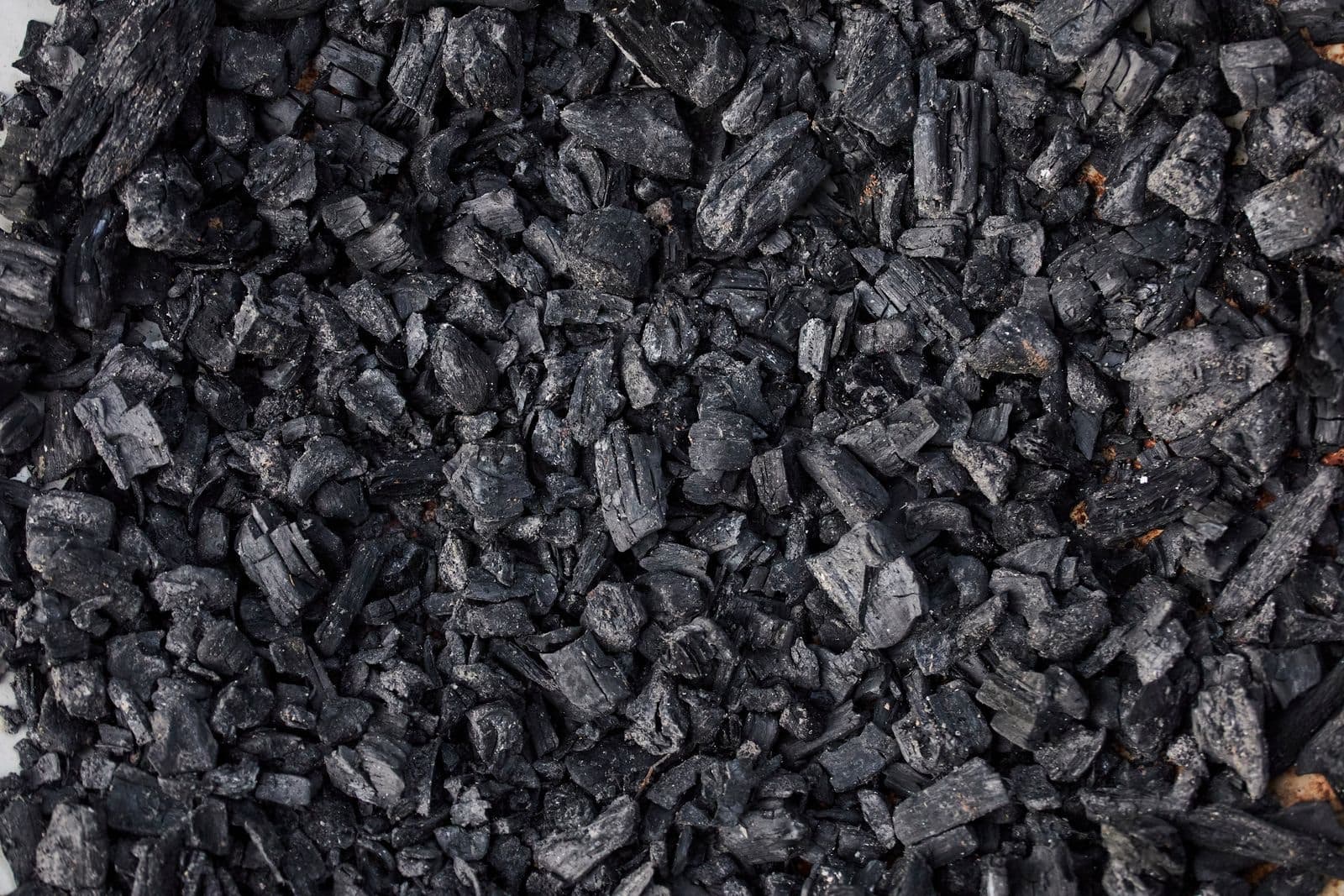 Close-up of small black charcoal pieces